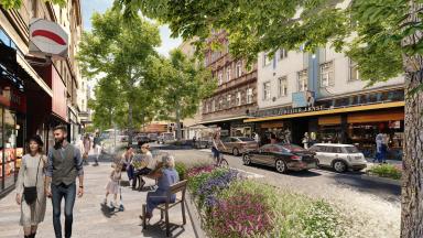 Rendering der zukünftigen Reinprechtsdorfer Straße. Im Vordergrund ein belebter Gehsteig mit Sitzgelegenheiten. Dahinter sichtbar zwei Fahrspuren und eine Parkspur. Begrünung mit Bäumen. (c) 2022WWW.OLN.AT